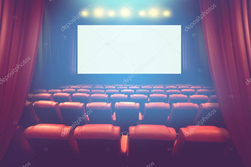 empty theater auditorium with blank screen or movie cinema with red seats before show time