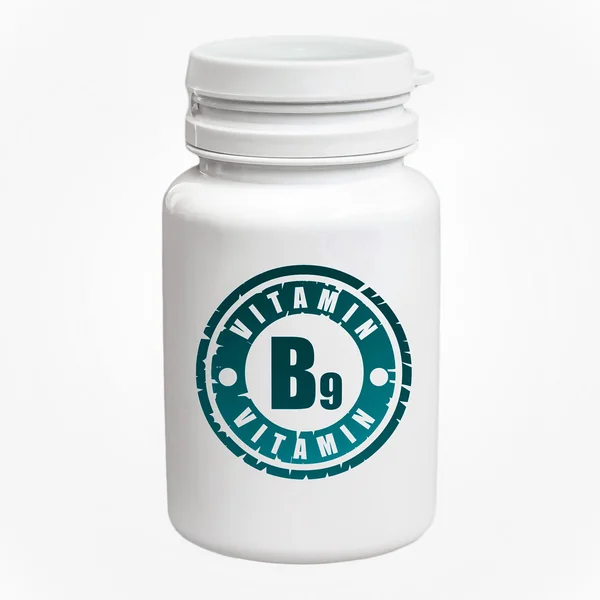 Бутылка таблеток с витамином В9 — стоковое фото