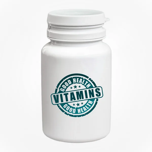 Бутылка таблеток с витаминами — стоковое фото