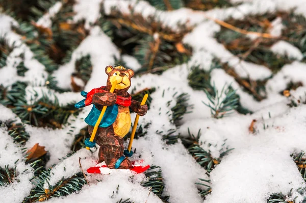 Bear on skis, snowy pine tree decorated for xmas — Stock Photo, Image