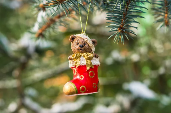 Teddy bear and red sock, Christmas toy on a Christmas tree — Stock Photo, Image