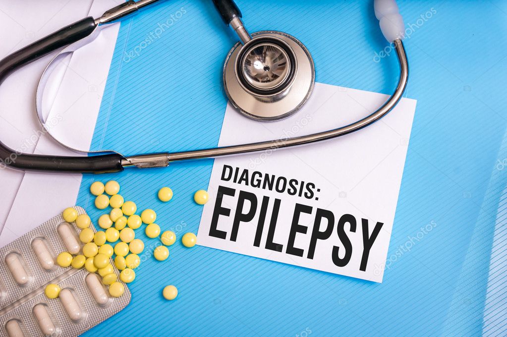 Epilepsy word written on medical blue folder with patient files