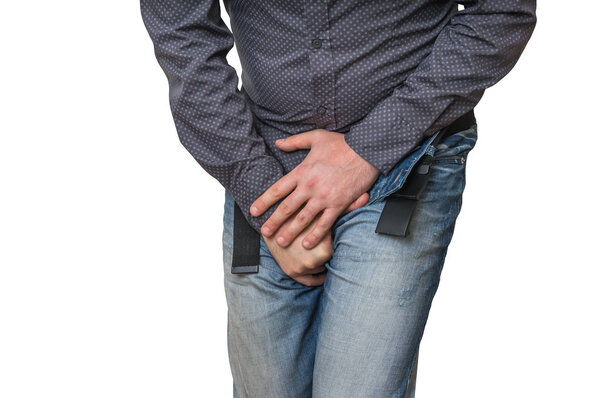 Man with hands holding his crotch, he wants to pee, incontinence