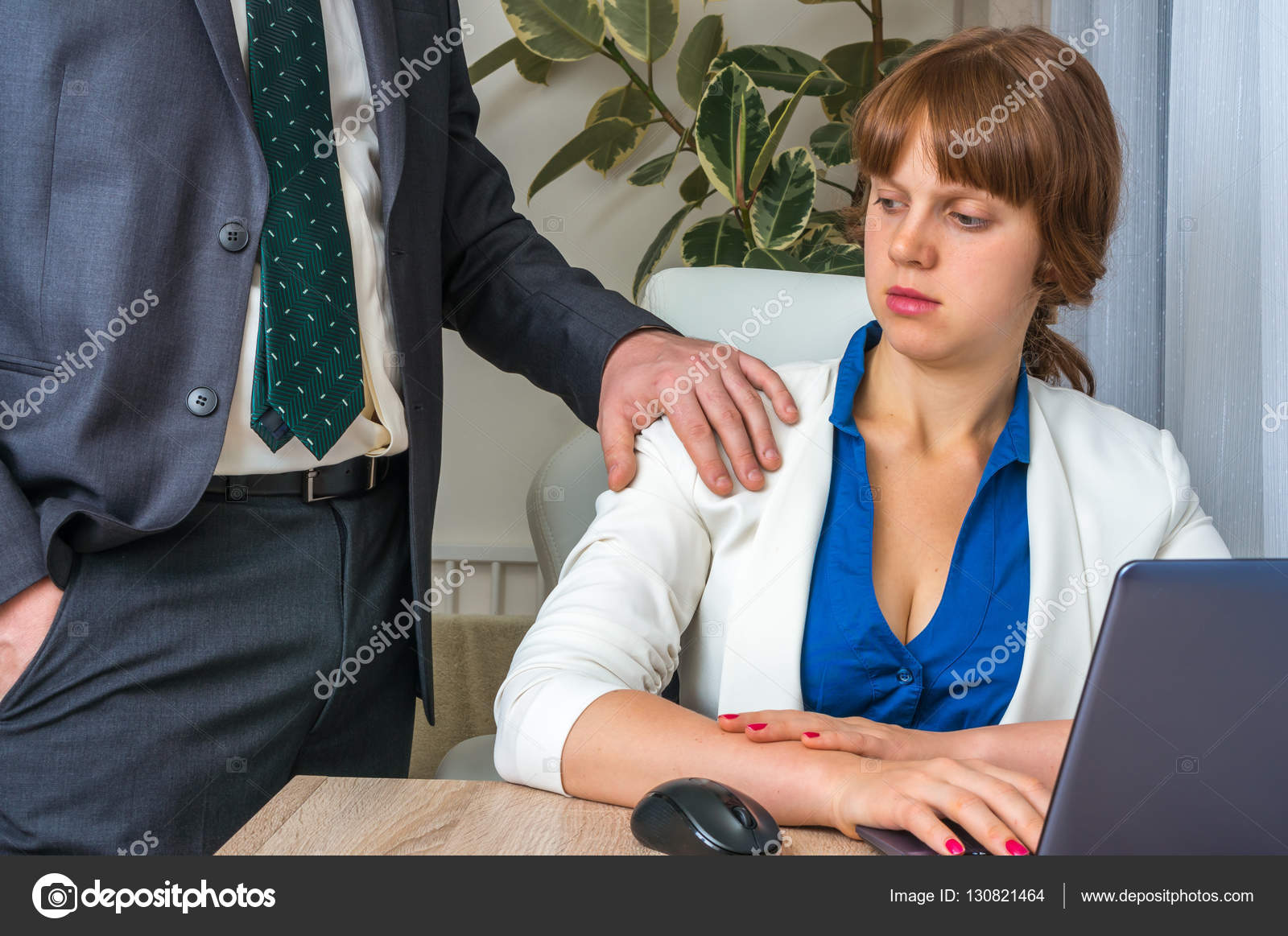 Man touching womans shoulder - sexual harassment in Man touching womans shoulder - sexual harassment in