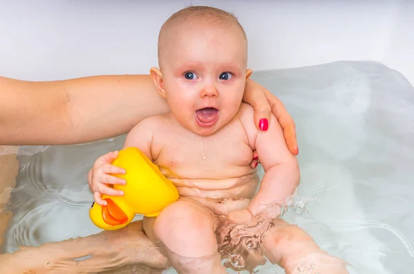 Newborn baby bathing in the bathroom — Stock Photo, Image