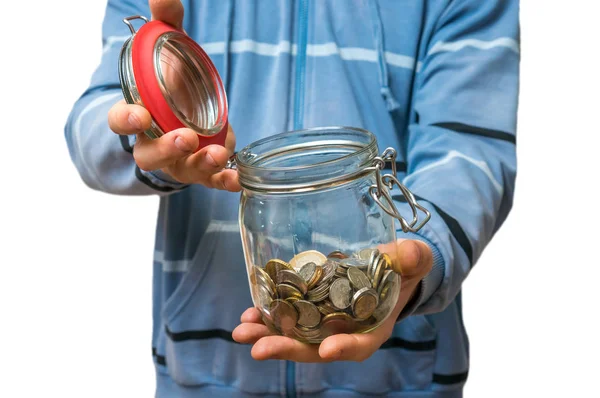 Hombre de sudadera azul sosteniendo tarro de dinero con monedas —  Fotos de Stock