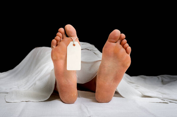 The dead woman's body with blank tag on feet
