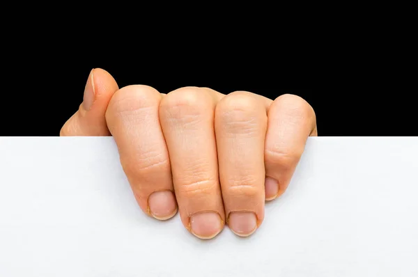 Kvinnas hand hålla vitt blankt papper - isolerad på svart — Stockfoto