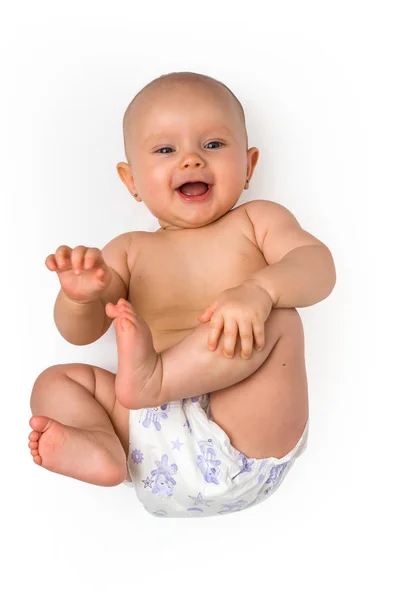 Adorable baby girl lying on back - isolated on white — Stock Photo, Image