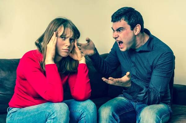 Unhappy couple having argument at home — Stock Photo, Image