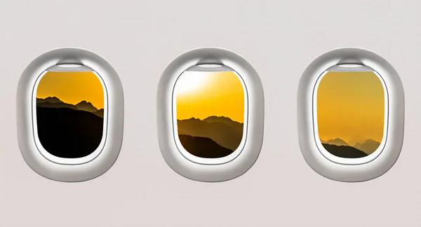 Vista de las montañas y puesta de sol desde las ventanas del avión — Foto de Stock