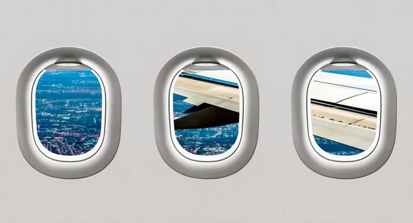 Kanat ve büyük şehirden uçak windows görünümünü — Stok fotoğraf
