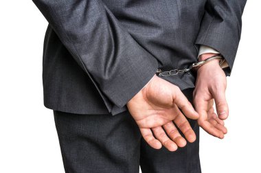 Elleri arkadan kelepçeli tutuklandı iş adamı