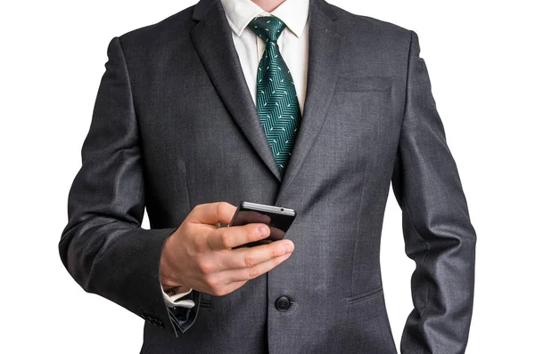 Empresario en traje negro con teléfono móvil — Foto de Stock