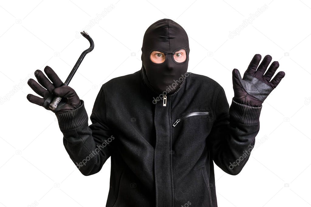 Arrested thief in balaclava with crowbar and raised arms