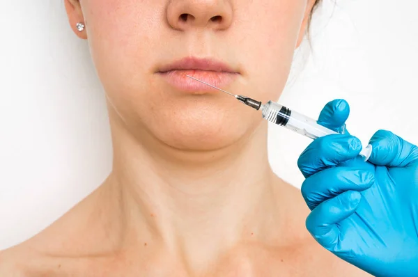 Woman gets injection in her face - cosmetic concept — Stock Photo, Image