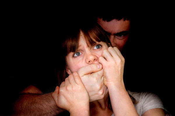 Man covering woman\'s mouth so she couldn\'t scream