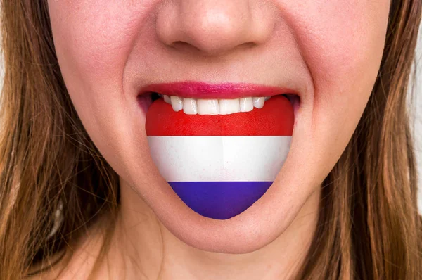 Woman with dutch flag on the tongue