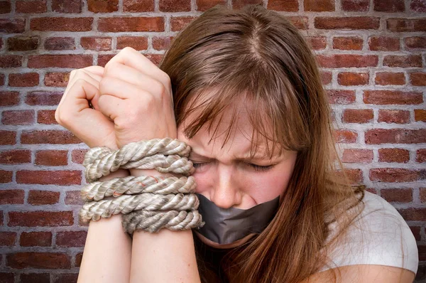 Tied rope hands of abused woman - violence concept — Stock Photo, Image