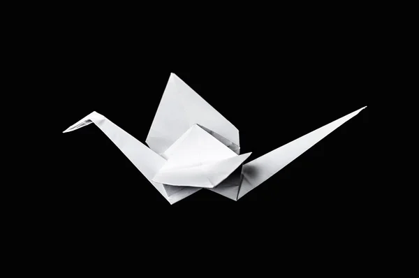 Origami kraan geïsoleerd op zwarte achtergrond — Stockfoto