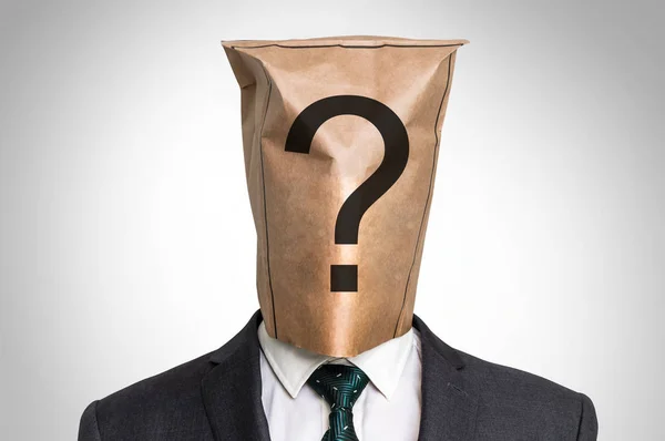 Empresário com uma bolsa na cabeça - com ponto de interrogação — Fotografia de Stock