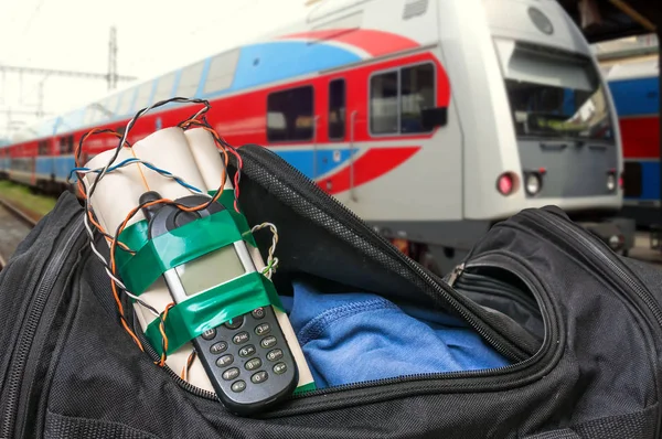 Dynamite bomb with phone in terrorist bag on train station — Stock Photo, Image