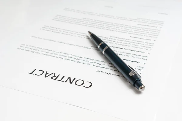 Close-up of ballpoint pen on contract — Stock Photo, Image