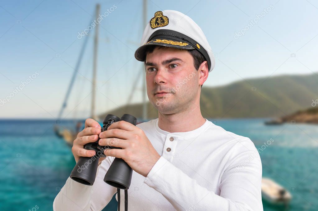 Happy captain holding binoculars