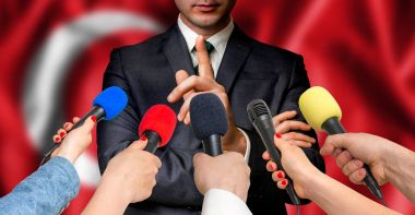 Turkish candidate speaks to reporters - journalism concept clipart