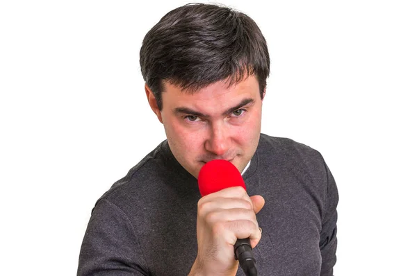 Eleganter Mann mit rotem Mikrofon isoliert auf weiß — Stockfoto