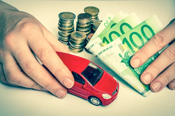 Toy car and euro money - insurance, rent and buying car — Stock Photo, Image