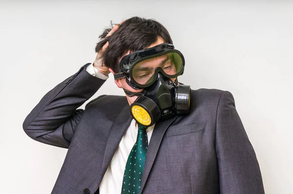 Businessman with gas mask isolated on white — Stock Photo, Image