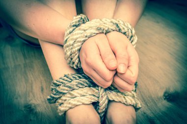 Kidnapped woman tied with rope - retro style clipart