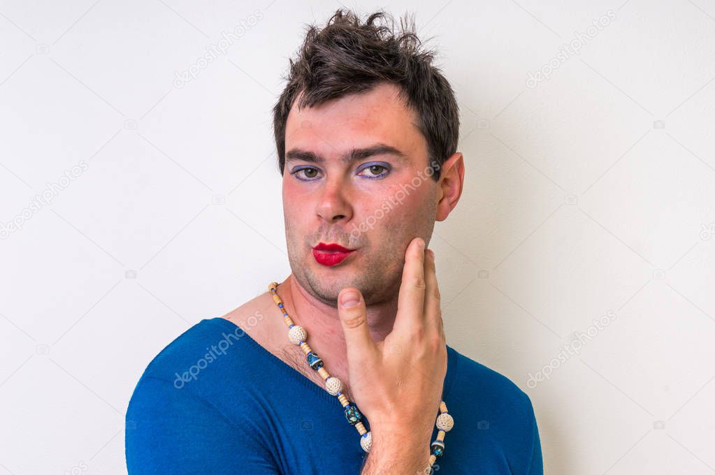 Man wearing makeup and dress looks like as a woman