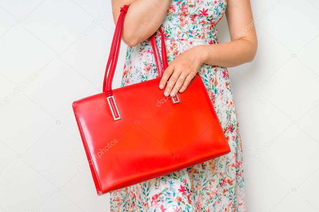 Fashion woman with red handbag