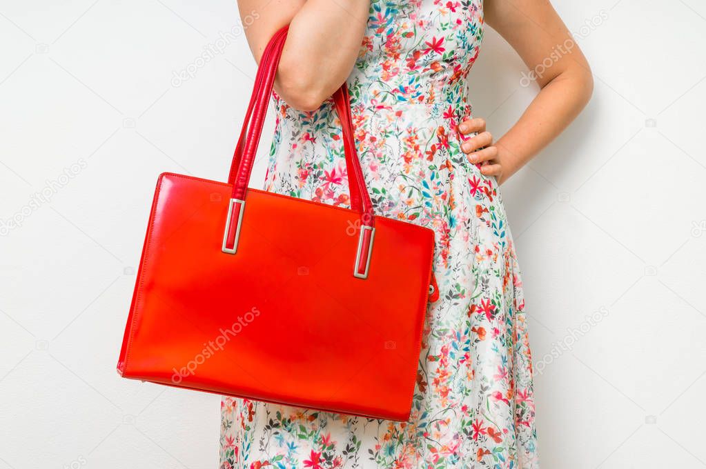 Stylish woman with leather handbag