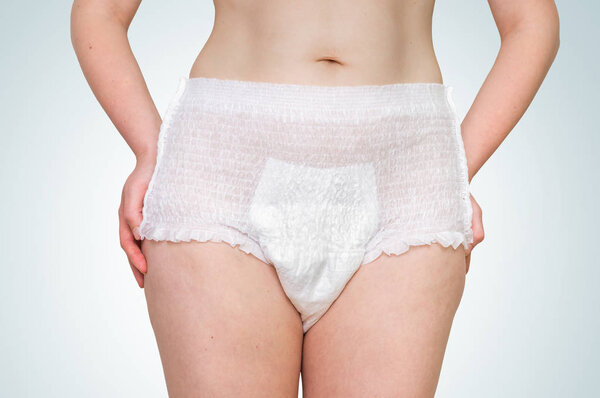 Woman wearing incontinence diaper