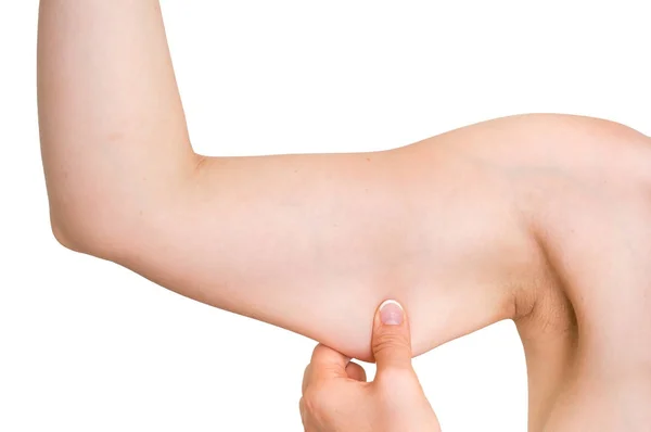 Frau testet ihren Muskel unter dem Arm — Stockfoto