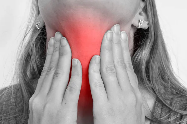 Woman with throat sore is holding her aching throat — Stock Photo, Image