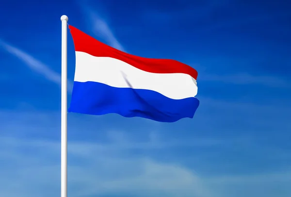 Mávání vlajkou Nizozemska na pozadí modré oblohy — Stock fotografie