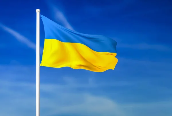 Macha flagą Ukrainy na tle niebieskiego nieba — Zdjęcie stockowe