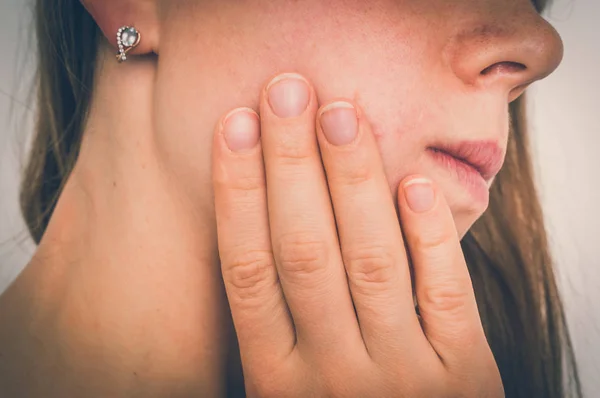 Woman with a painful expression is having toothache — Stock Photo, Image