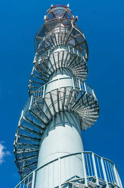 Telecommunications tower on blue sky background — Stock Photo, Image