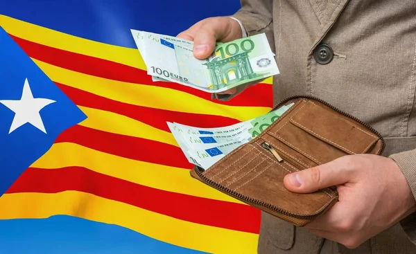 Investing money to Catalonia. Rich man with a lot of money.