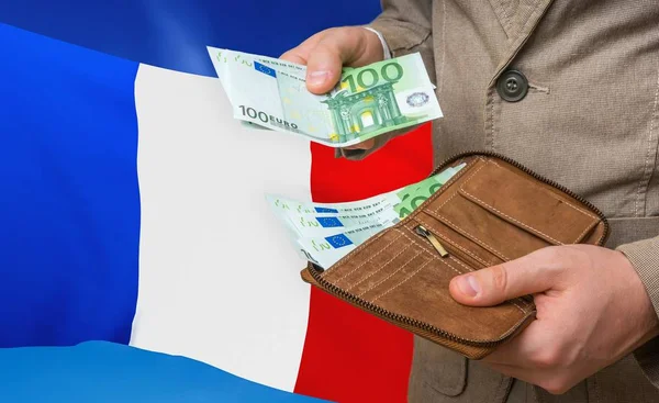 Investing money to France. Rich man with a lot of money.