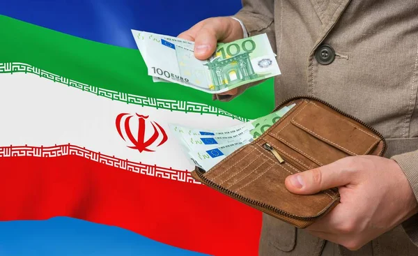 Investing money to Iran. Rich man with a lot of money.