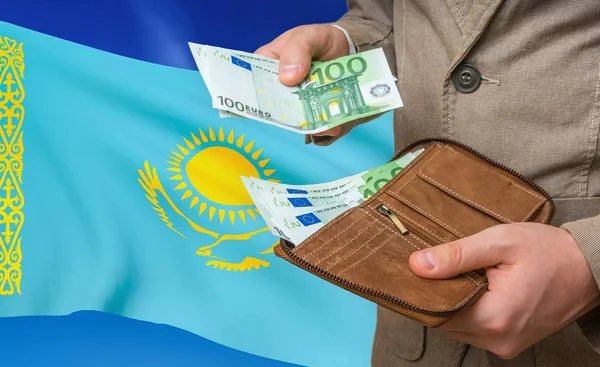 Investing money to Kazakhstan. Rich man with a lot of money.