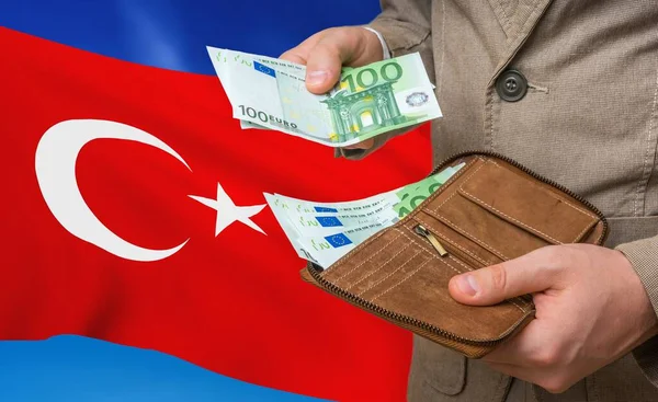 Investing money to Turkey. Rich man with a lot of money.