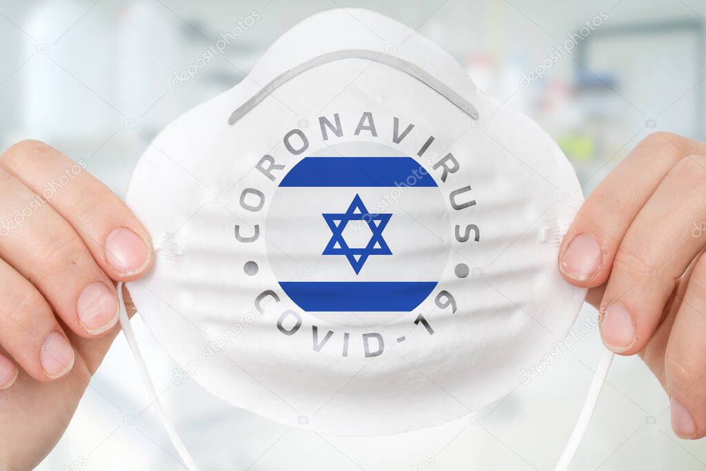 Respirator mask with flag of Israel - Coronavirus COVID-19 epidemic concept