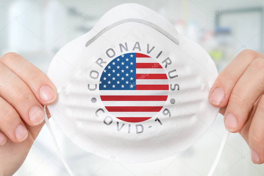 Respirator mask with flag of United States of America - Coronavirus COVID-19 epidemic concept